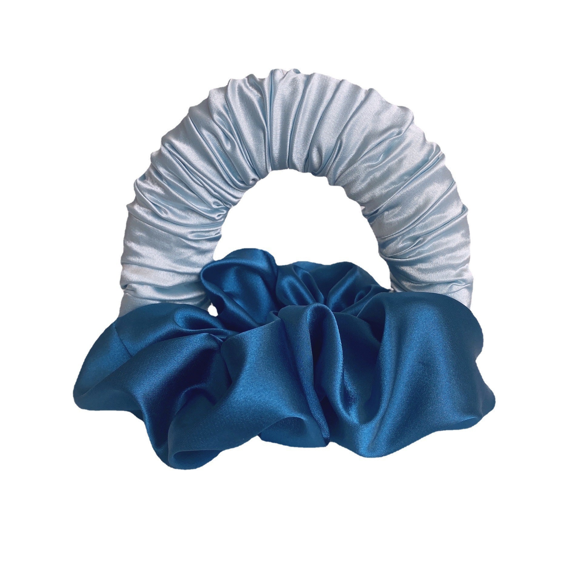 Blue scrunchie with a striped pattern on a white background