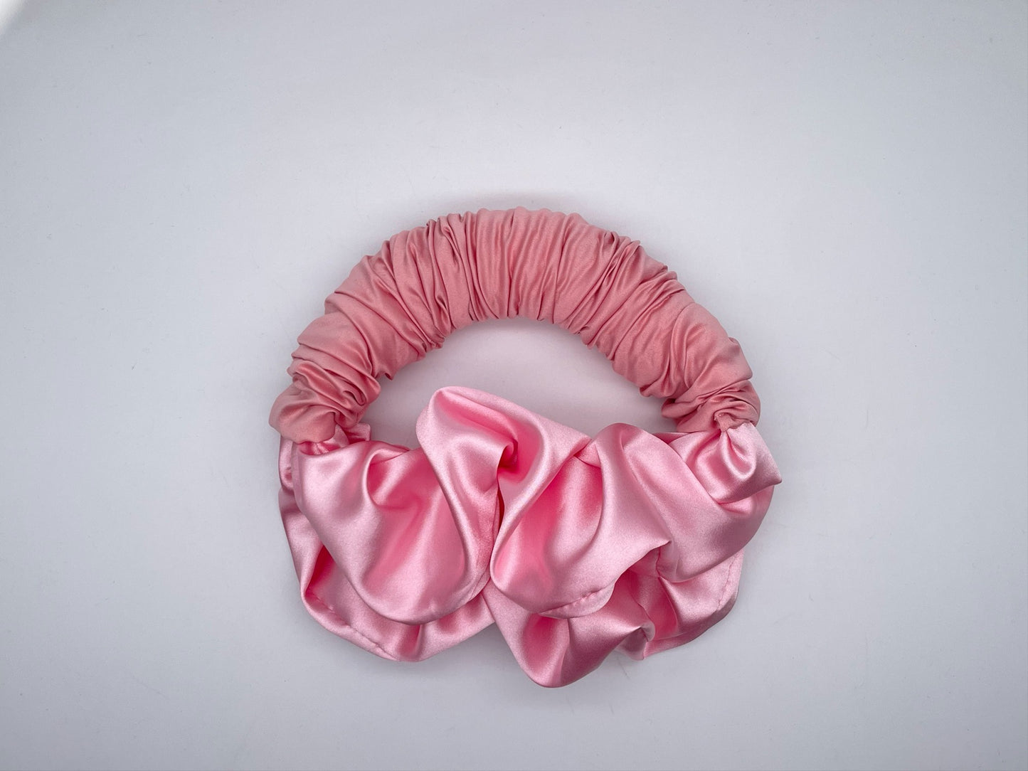 Luxe and Laurel pink sponge bun maker creating a voluminous French Twist 