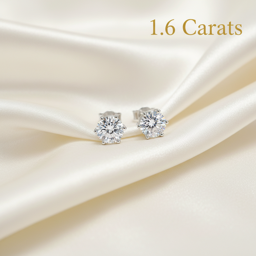 Diamond stud earrings flat lay with 1.6 carats text overlay
