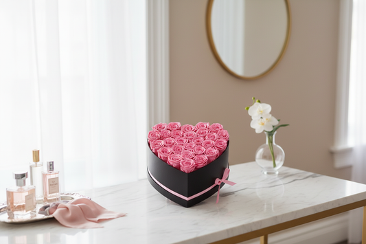 Editorial lifestyle photo of pink preserved roses heart-shaped box