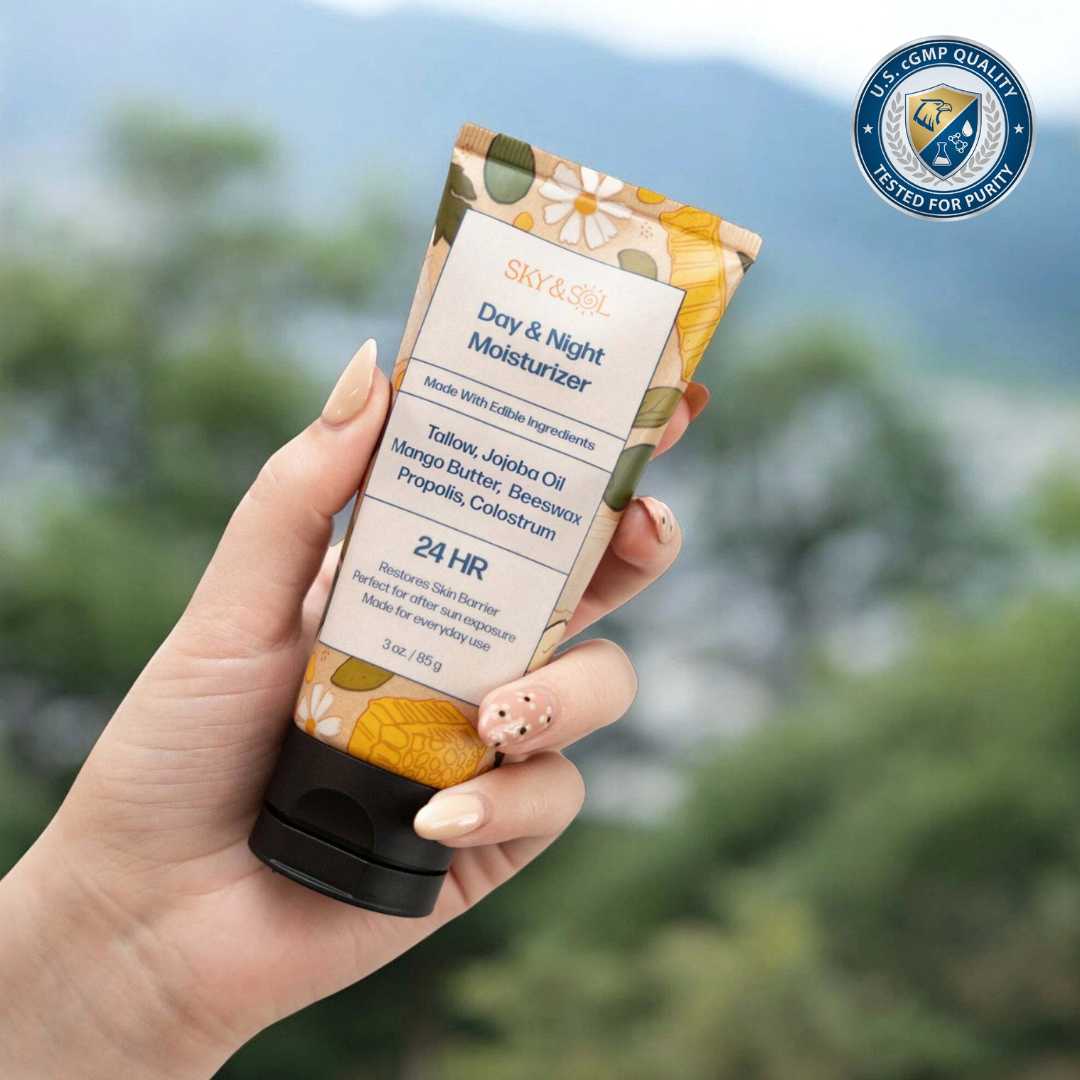 Hand holding a tube of Day & Night Moisturizer with a blurred natural background